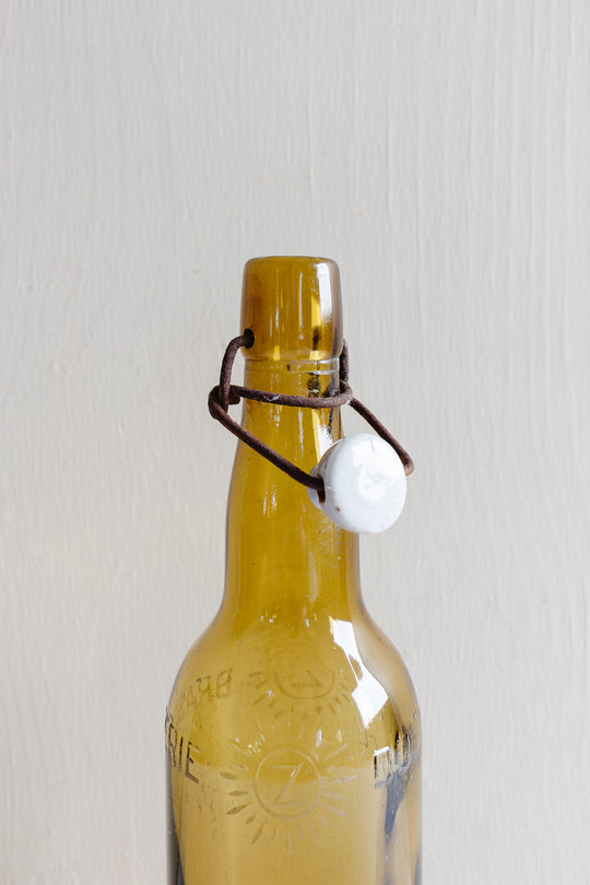 pair of vintage french amber brasserie bottles