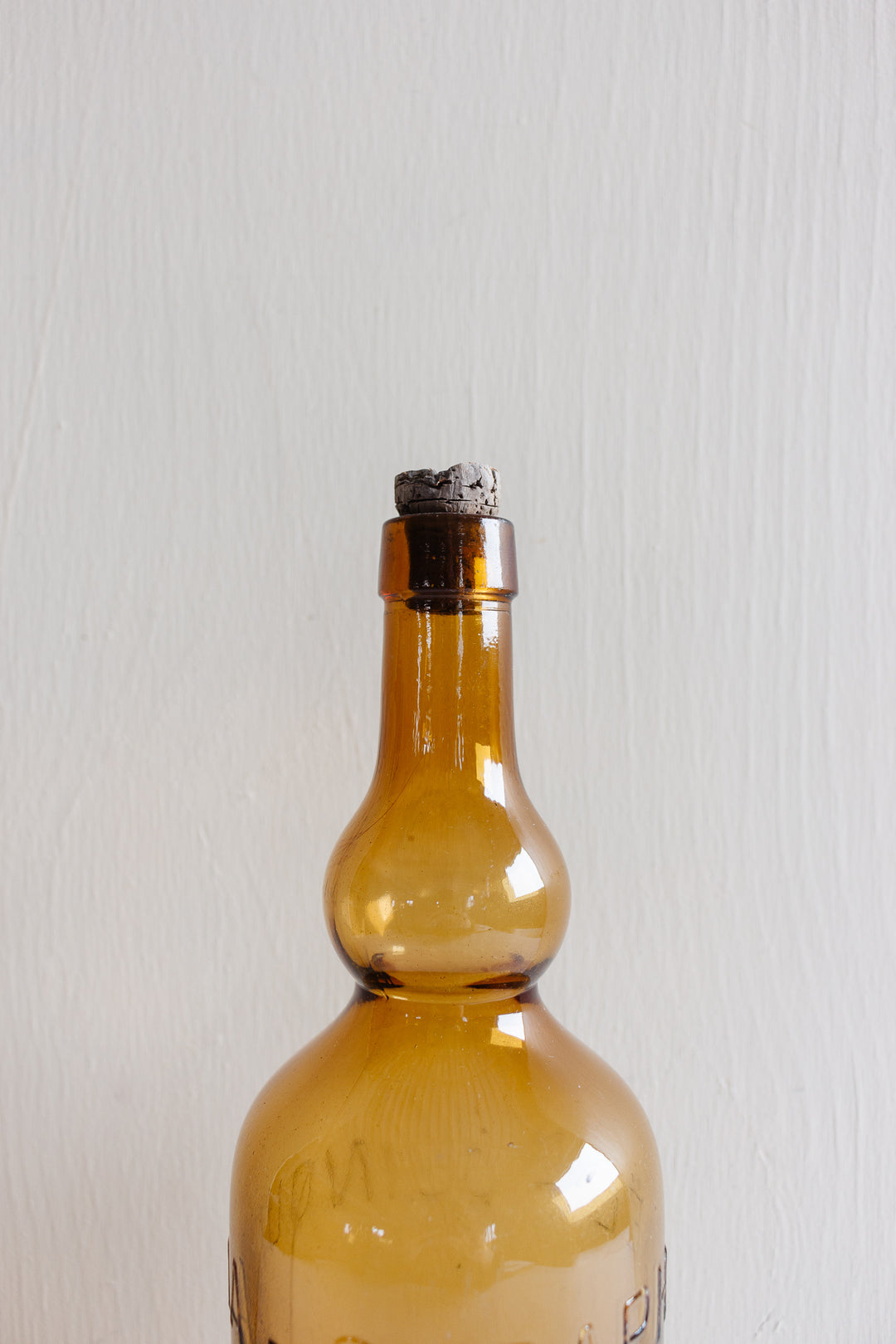 pair of vintage french amber brasserie bottles