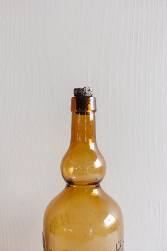 pair of vintage french amber brasserie bottles