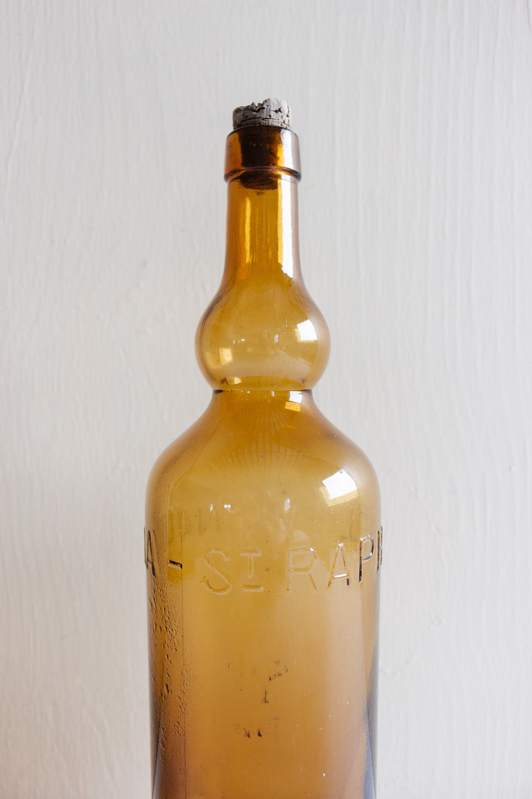 pair of vintage french amber brasserie bottles