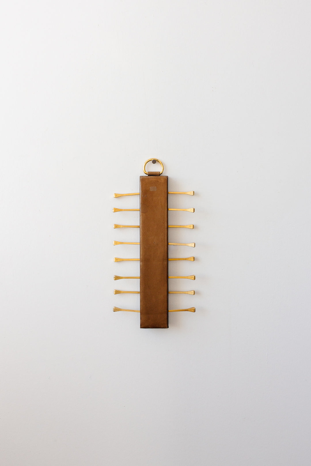 midcentury french brass and leather Longchamp tie rack by Jacques Adnet