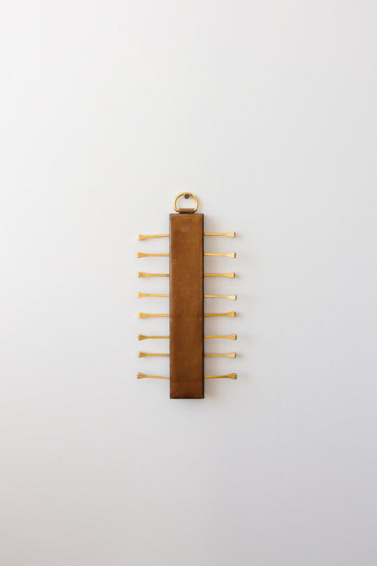 midcentury french brass and leather Longchamp tie rack by Jacques Adnet