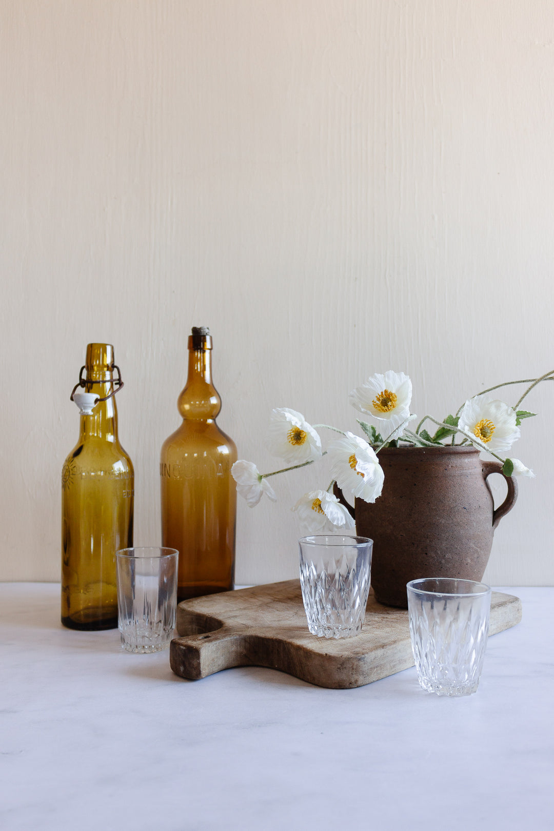 pair of vintage french amber brasserie bottles
