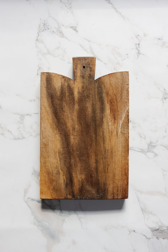 vintage french bread board with contrasting grain pattern