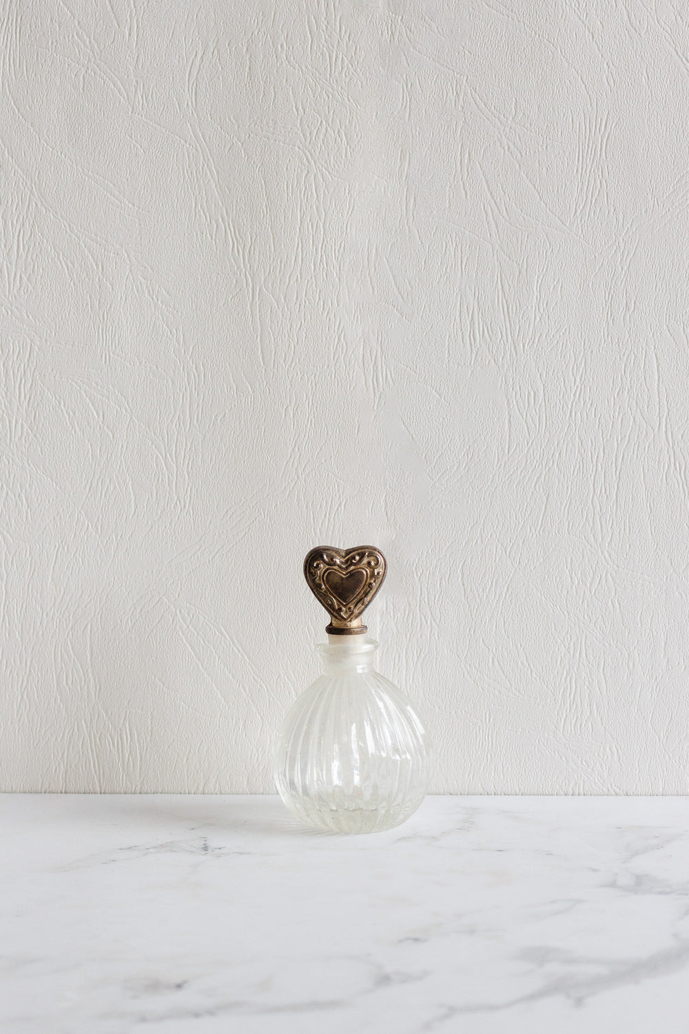 antique french perfume bottle pair with silver heart stopper