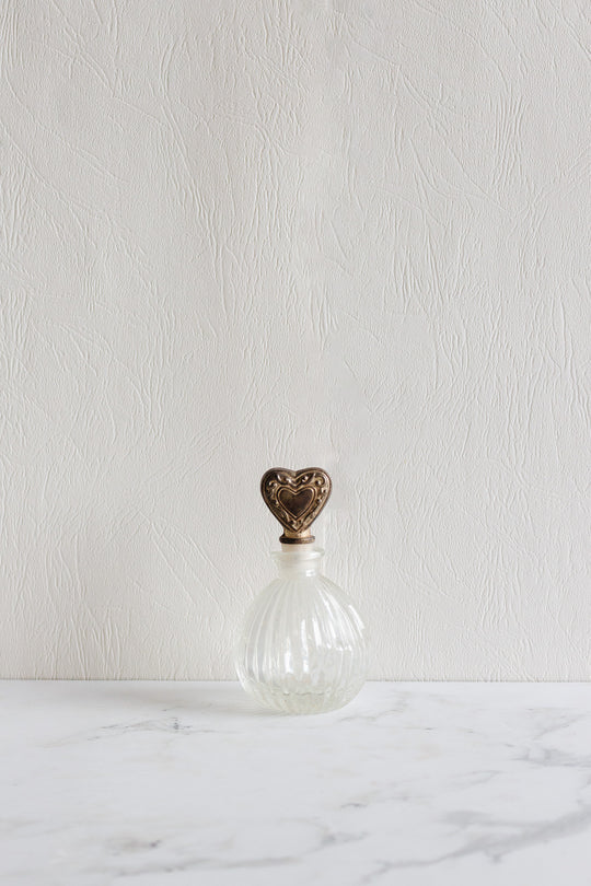 antique french perfume bottle pair with silver heart stopper