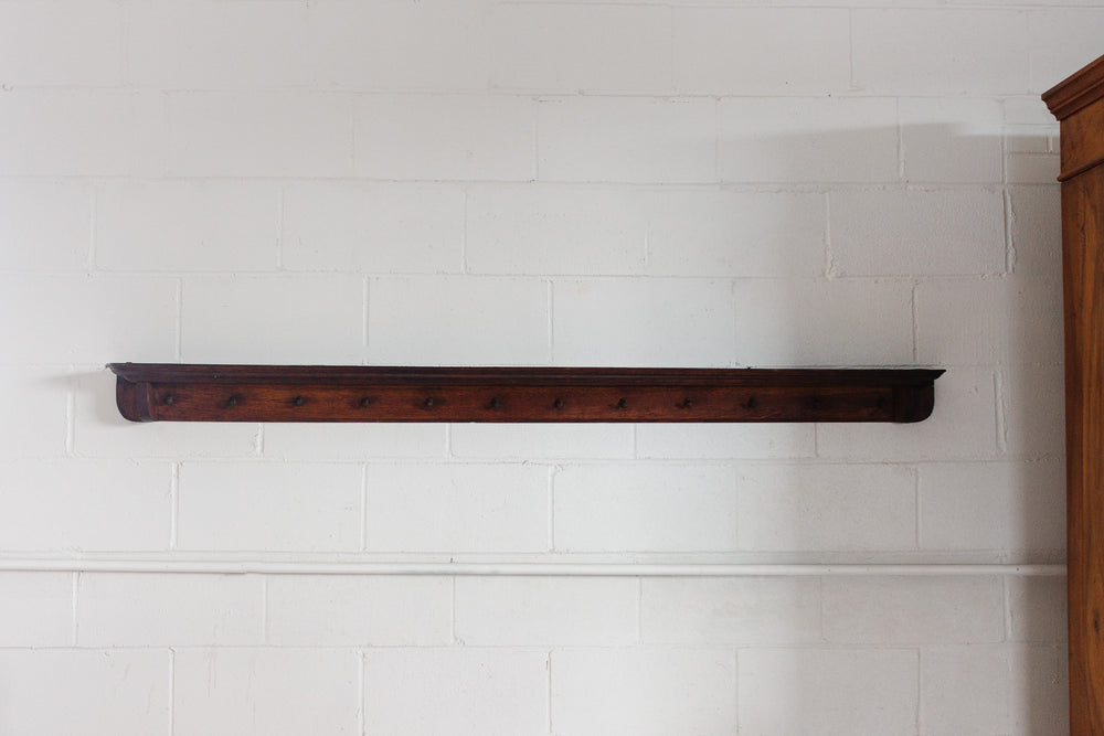 vintage french wooden rail with cast iron hooks