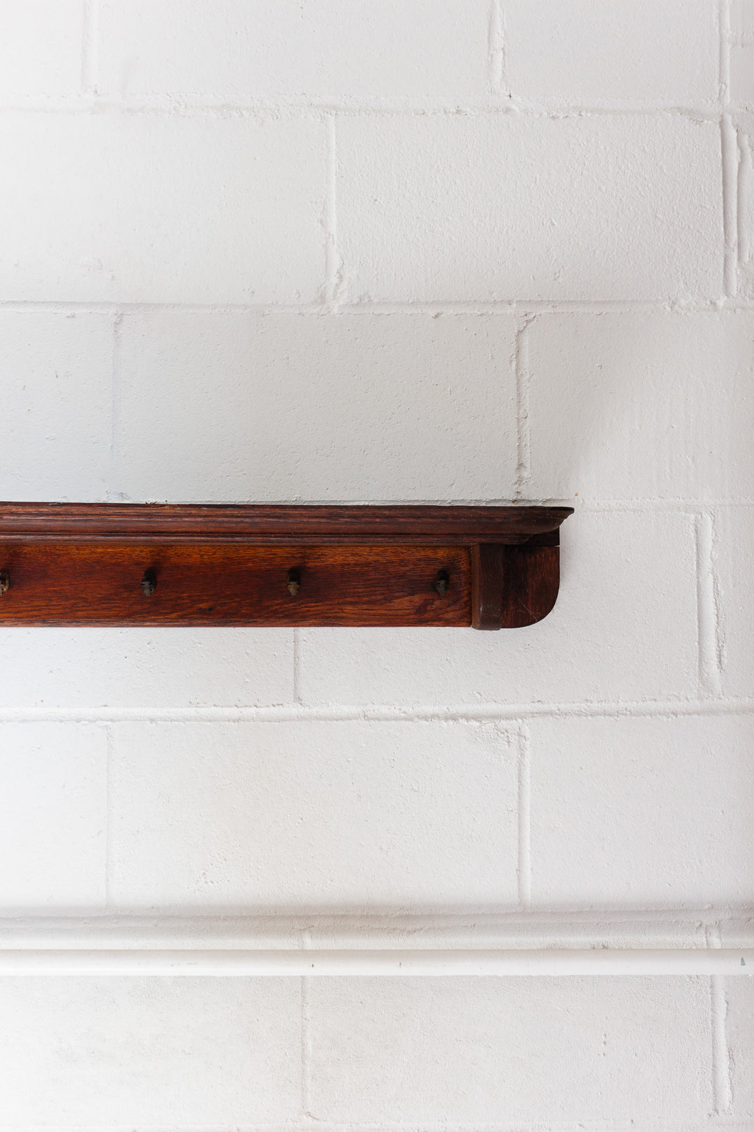 vintage french wooden rail with cast iron hooks