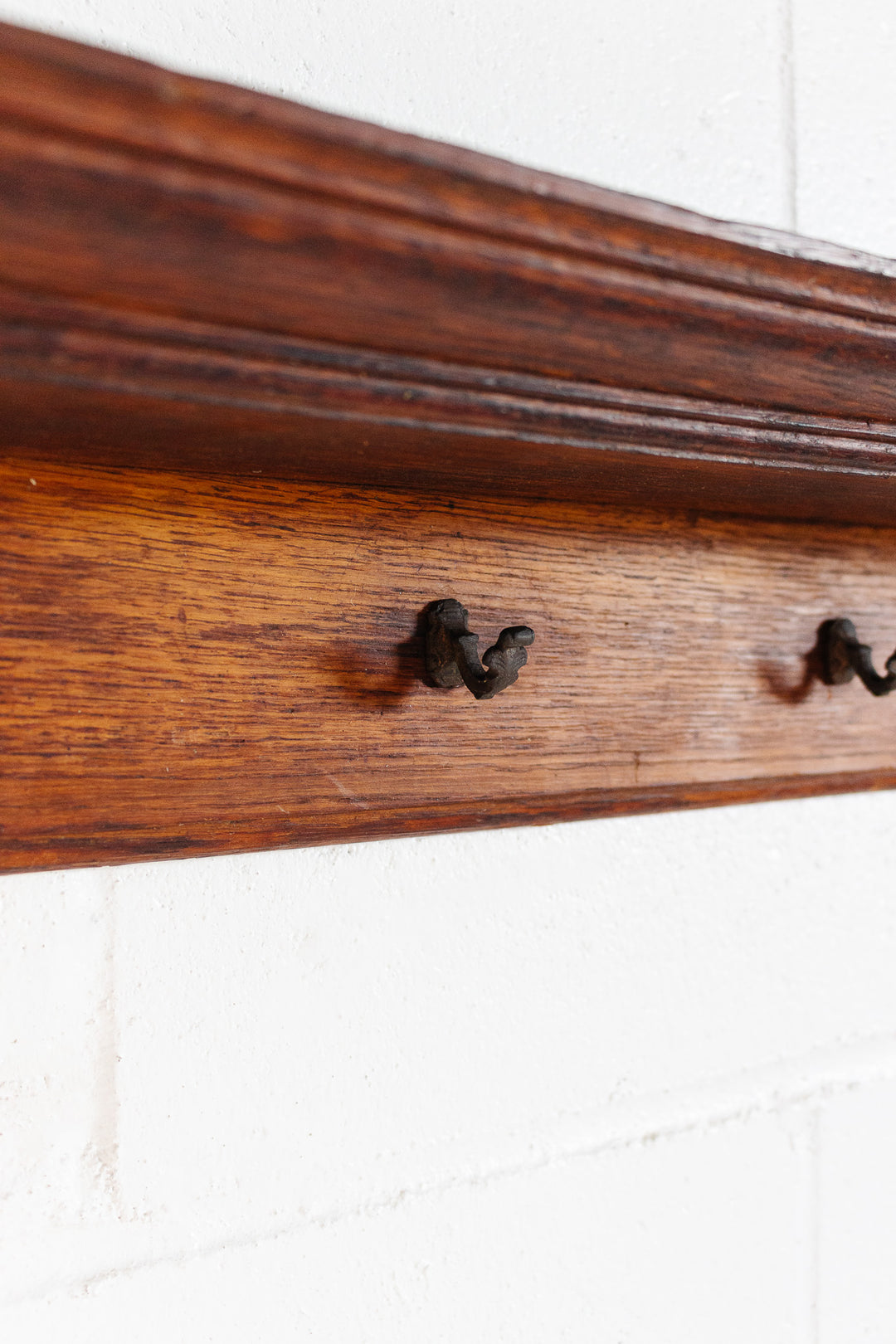 vintage french wooden rail with cast iron hooks