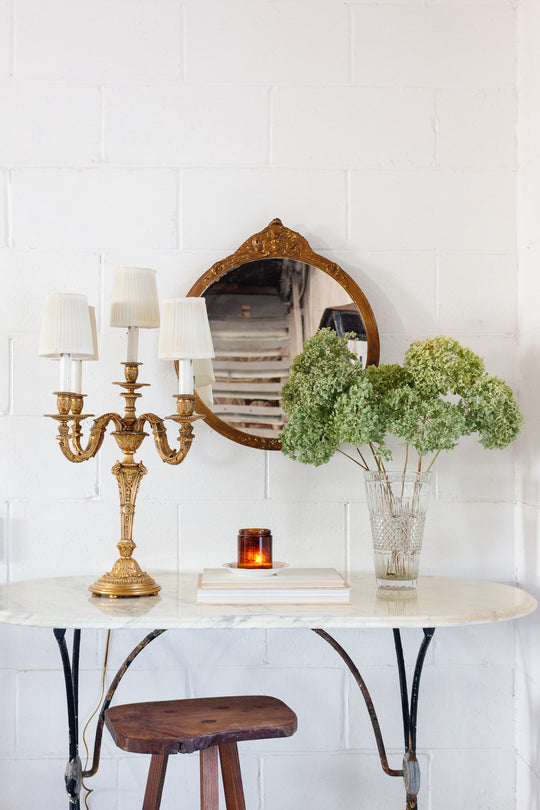 French bistro table with antique cast iron base and vintage marble top