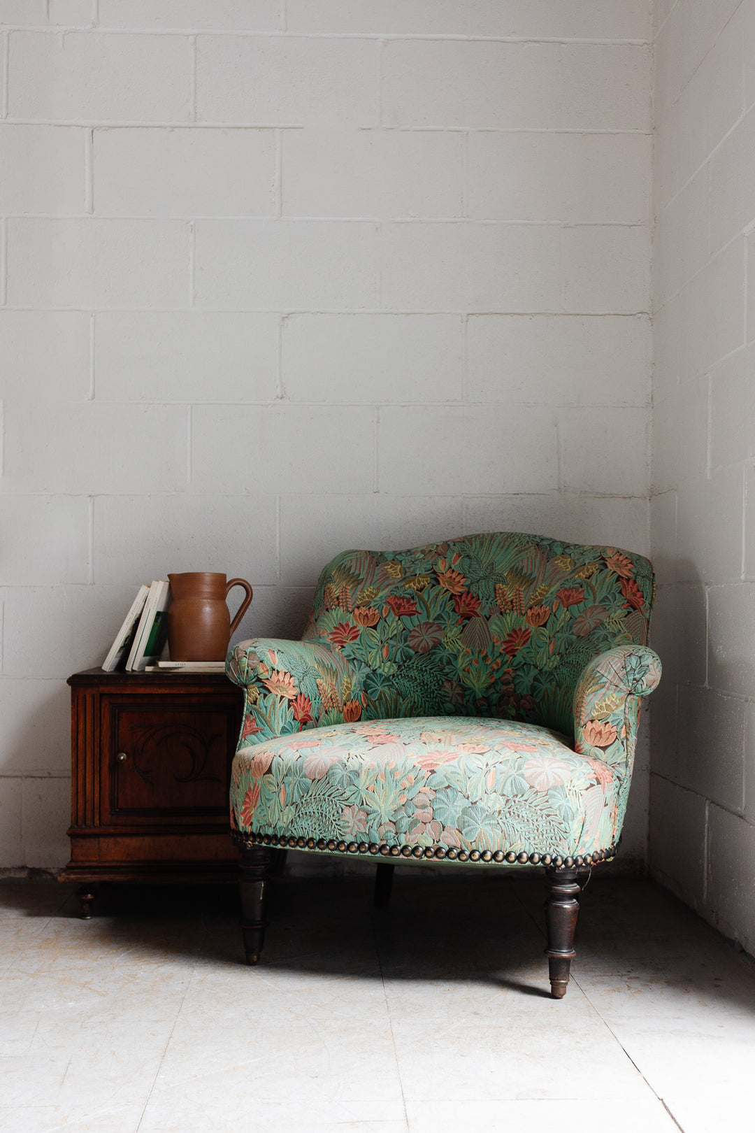 antique french crapaud chair with floral fabric
