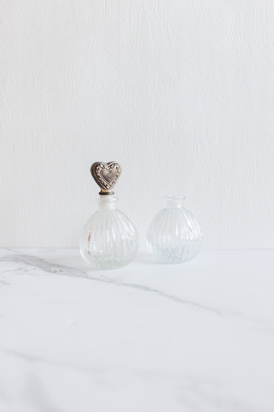 antique french perfume bottle pair with silver heart stopper