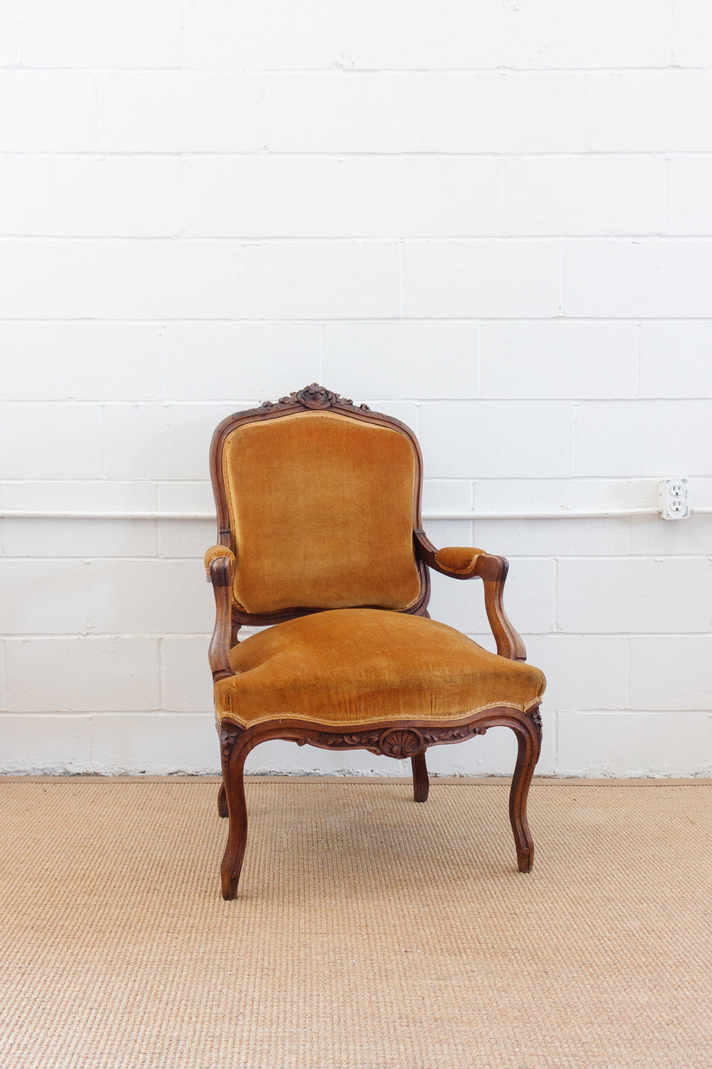 19th century Louis XV carved walnut and velvet armchair