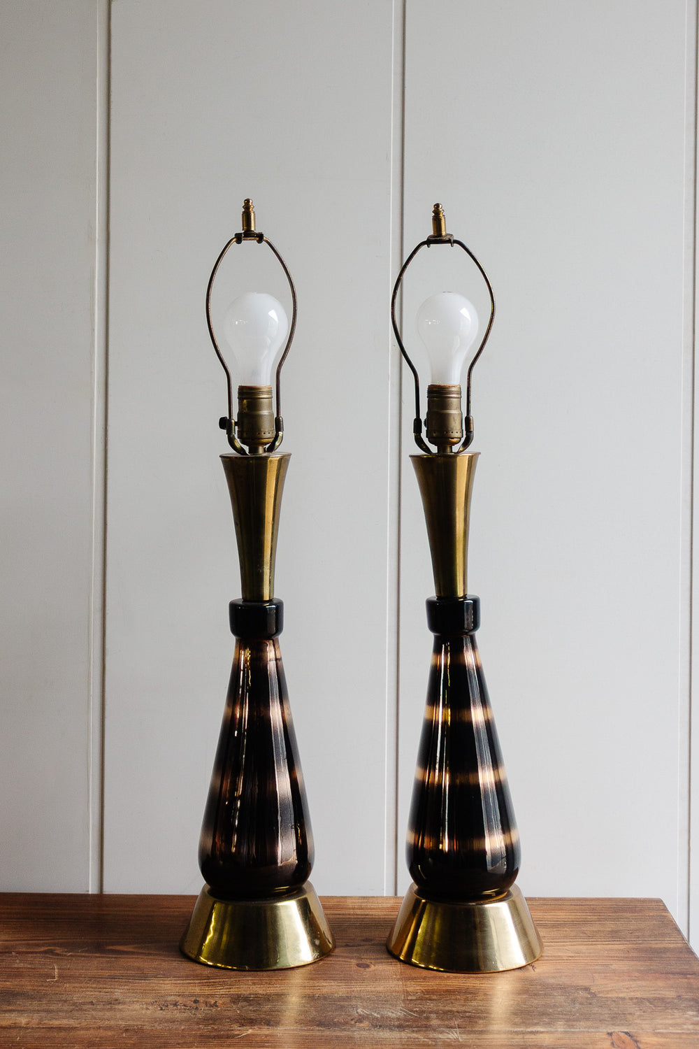 pair of tall vintage hollywood regency lamps