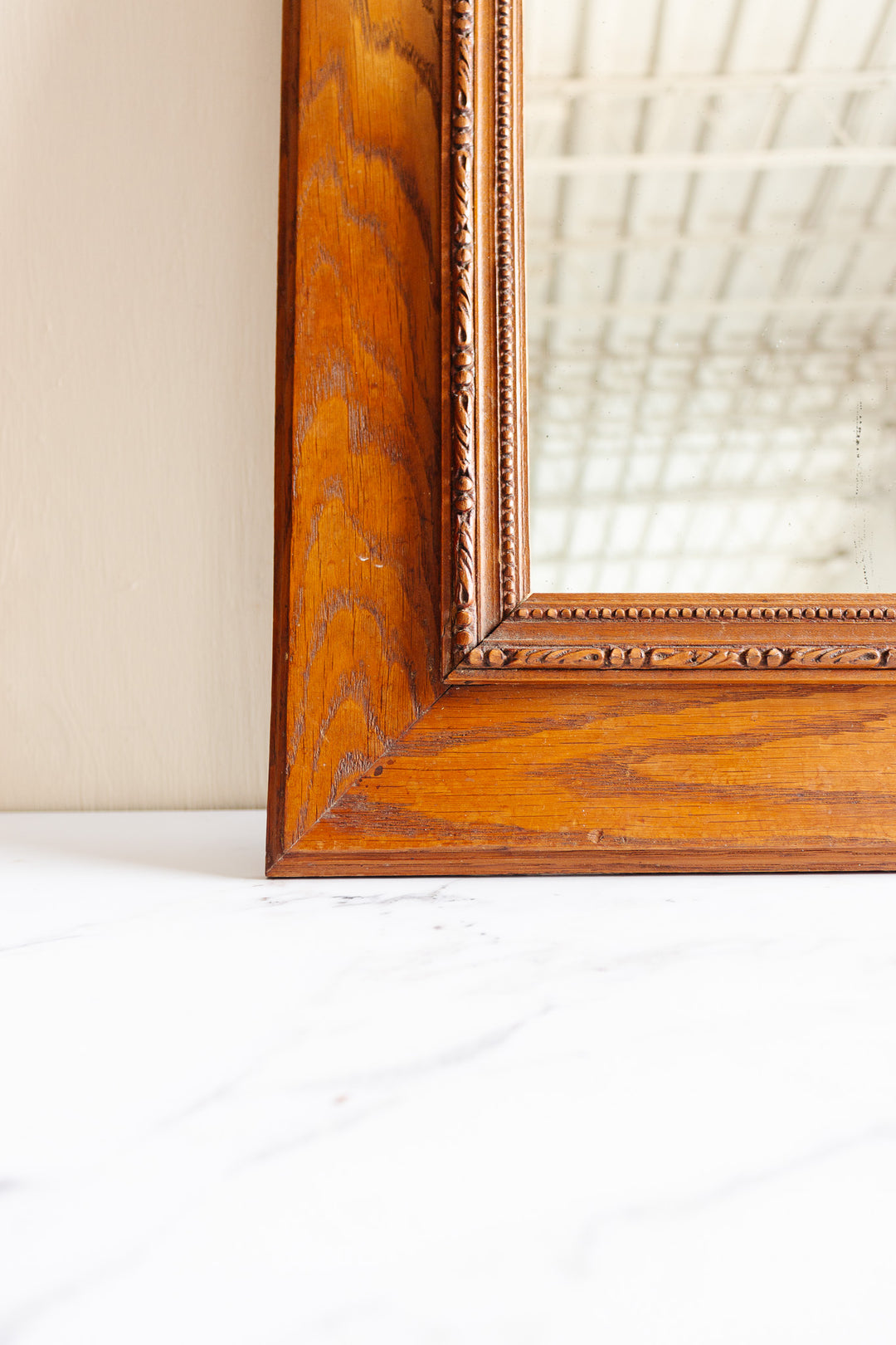 antique French carved oak mirror with Louis XVI style bow cornice
