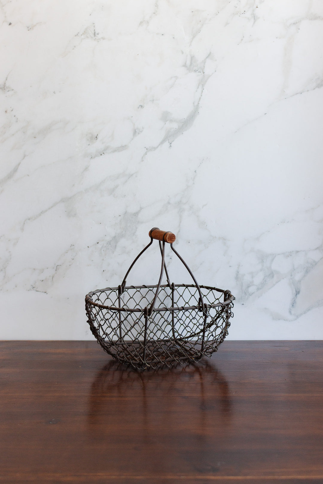 antique french metal panier with wood handle