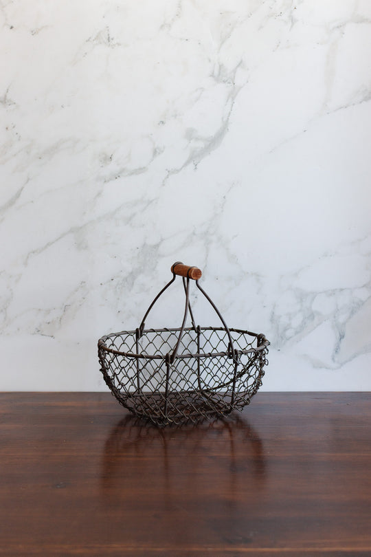 antique french metal panier with wood handle