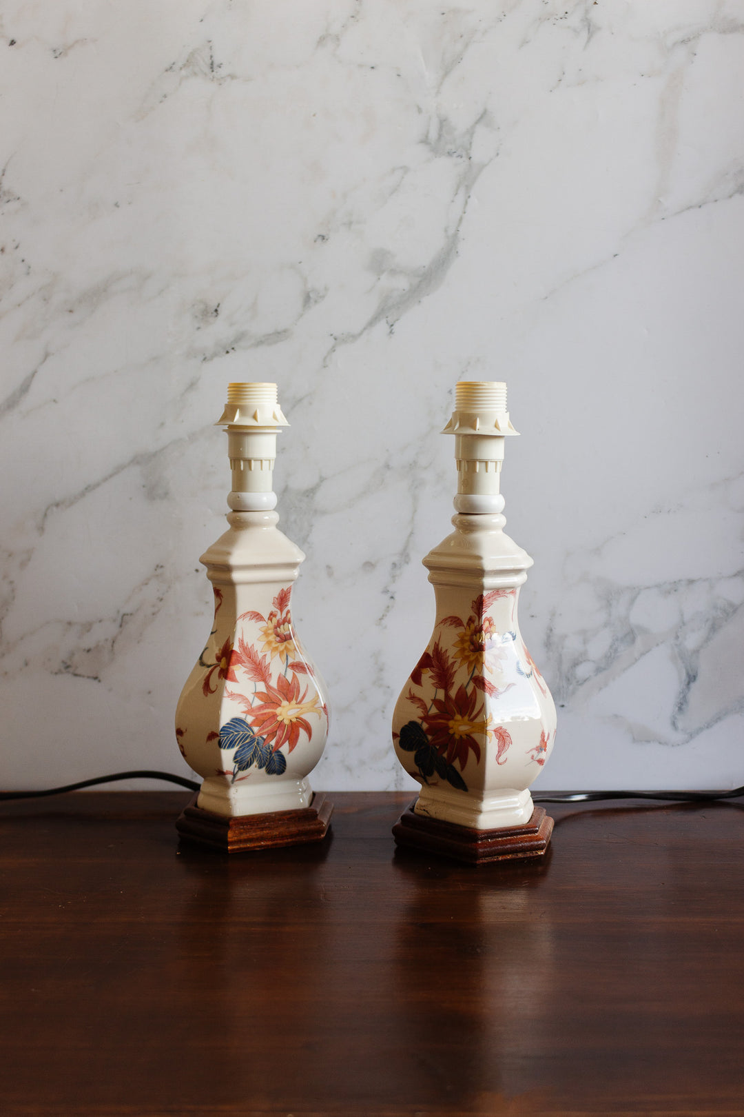 pair of vintage french handpainted porcelain lamps with fringed shades