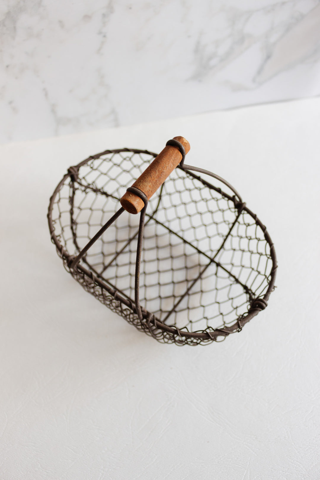antique french metal panier with wood handle