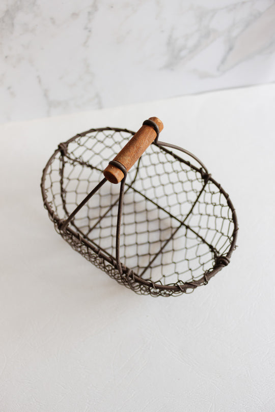 antique french metal panier with wood handle