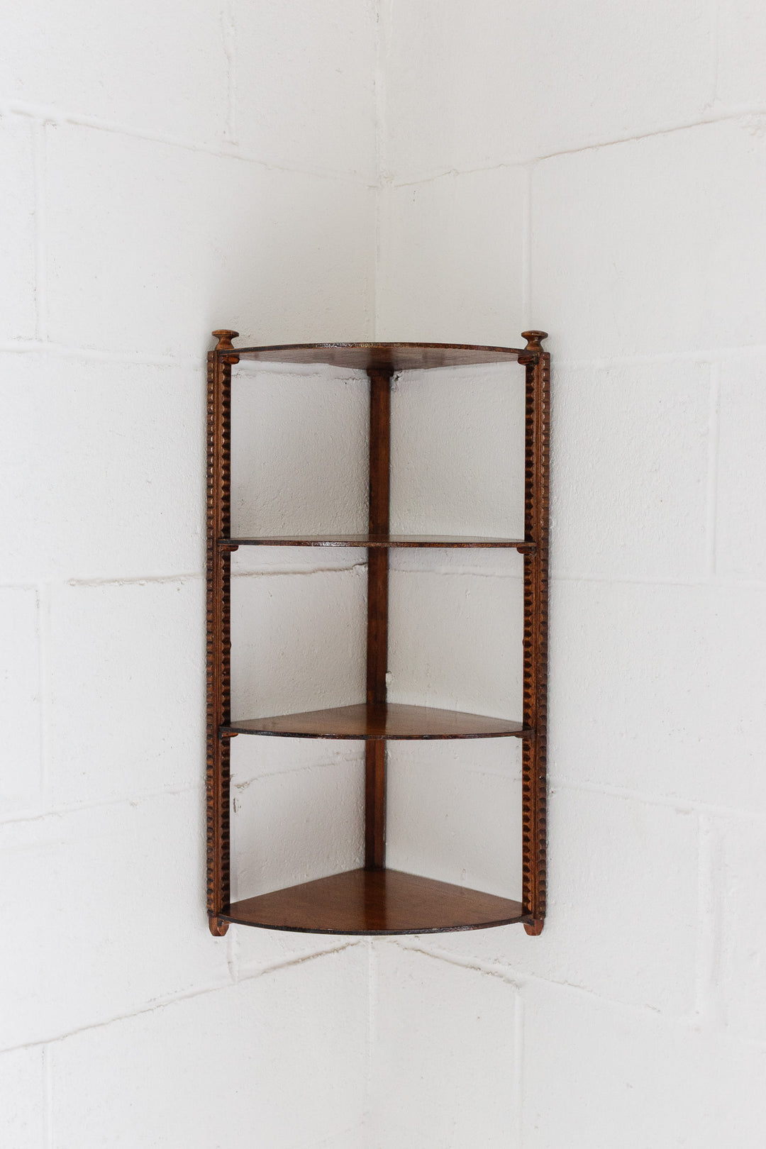 vintage english wood corner shelf with carved ornamentation