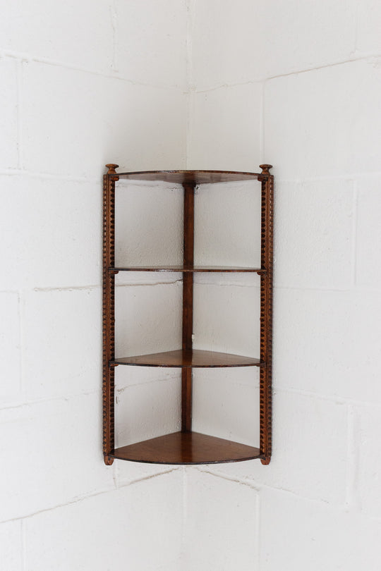 vintage english wood corner shelf with carved ornamentation