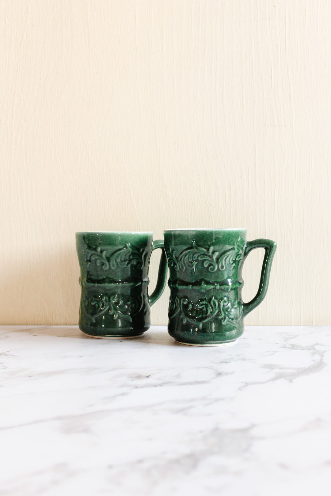pair of vintage French majolica mugs
