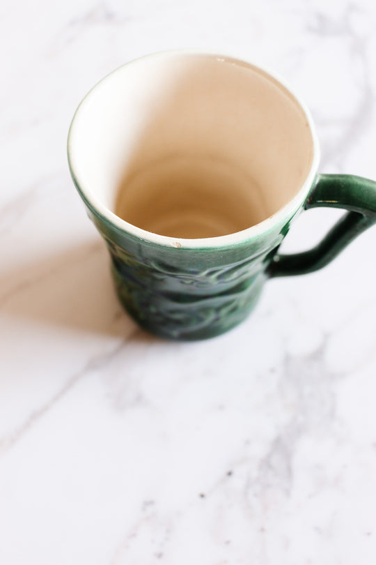 pair of vintage French majolica mugs