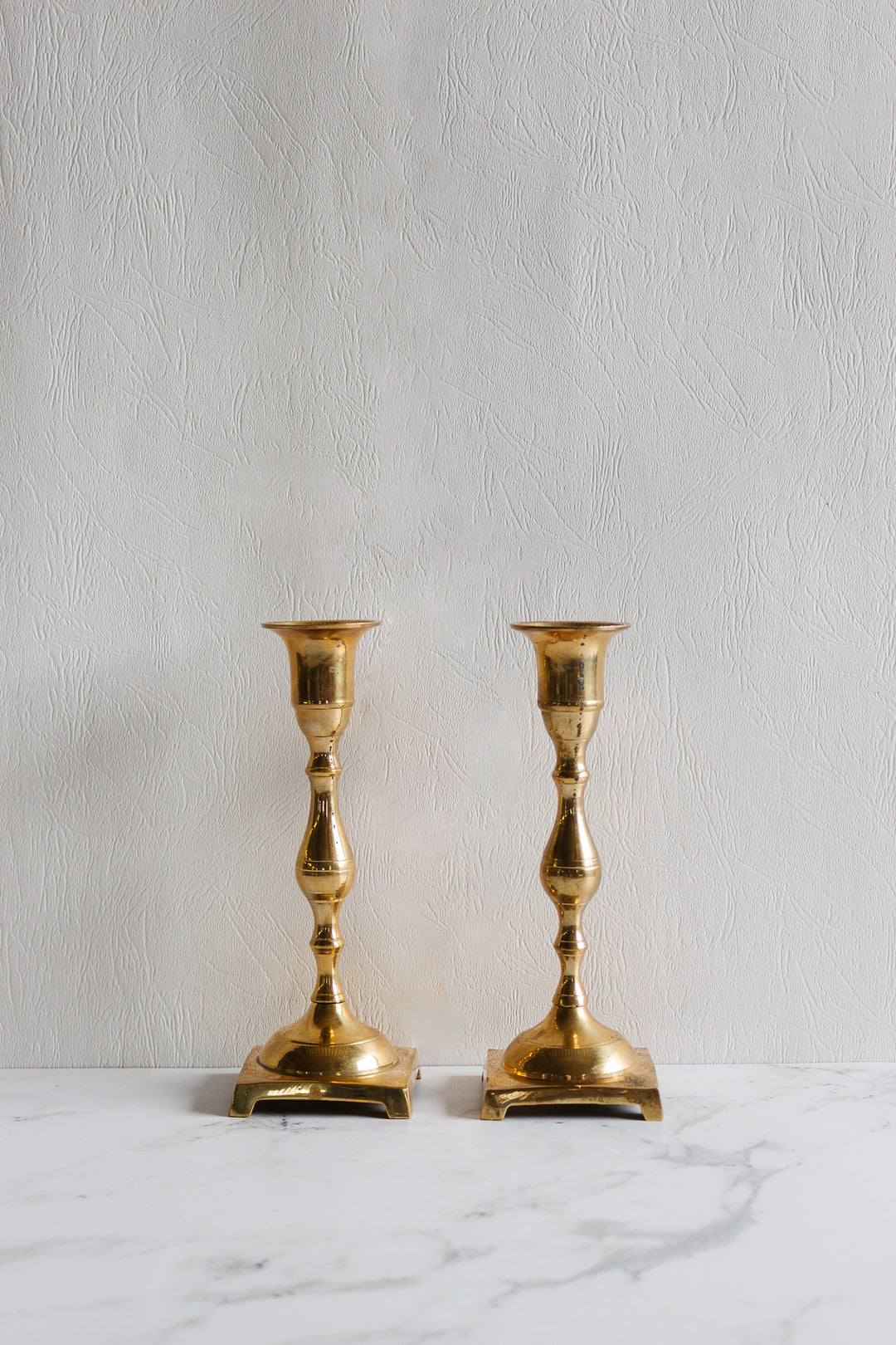 pair of vintage quintessentially french brass candlesticks