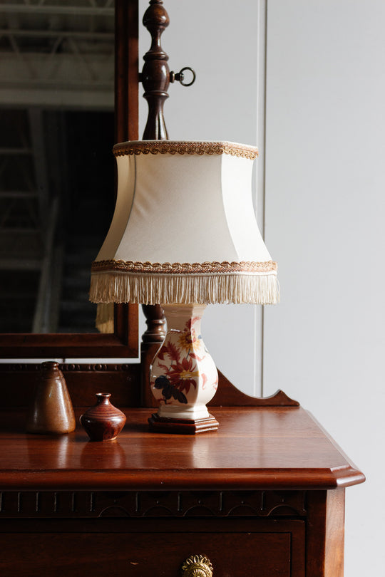 pair of vintage french handpainted porcelain lamps with fringed shades