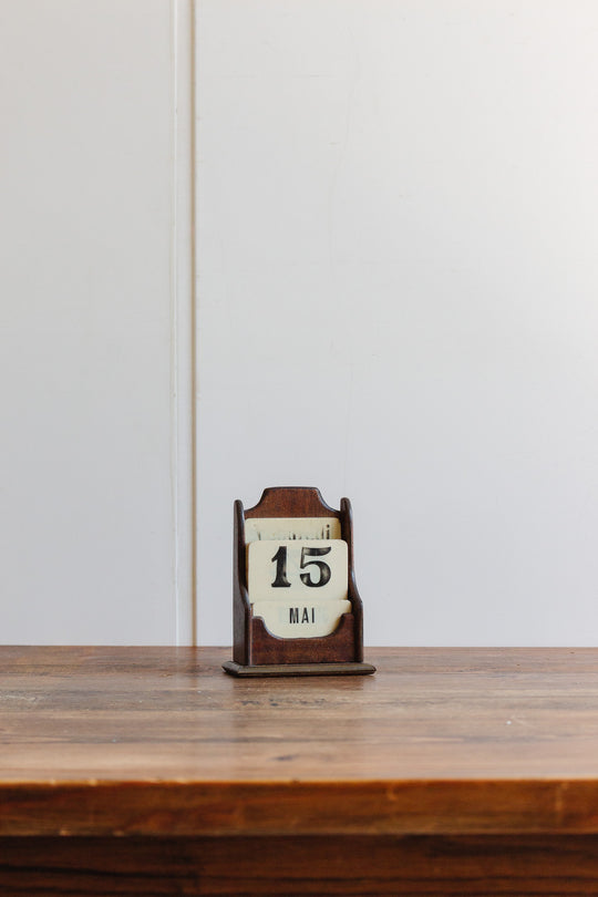vintage french perpetual calendar in wooden stand