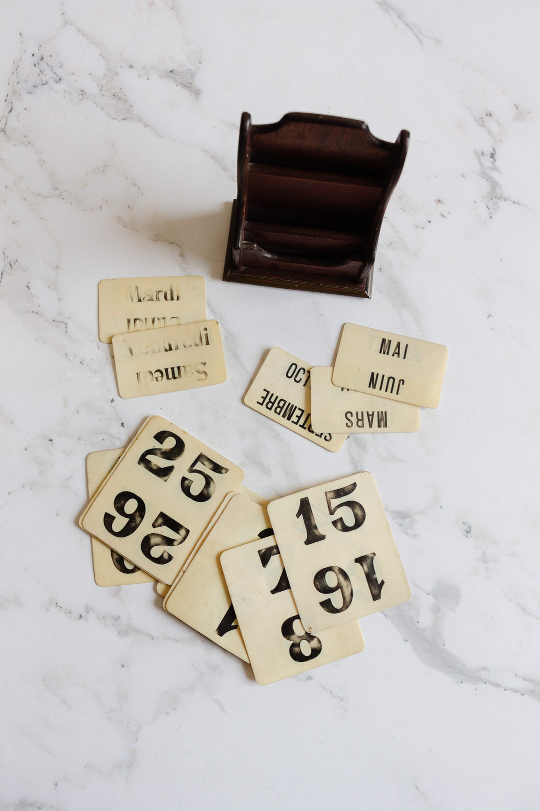 vintage french perpetual calendar in wooden stand