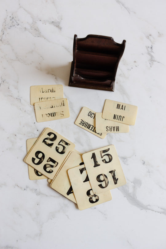 vintage french perpetual calendar in wooden stand