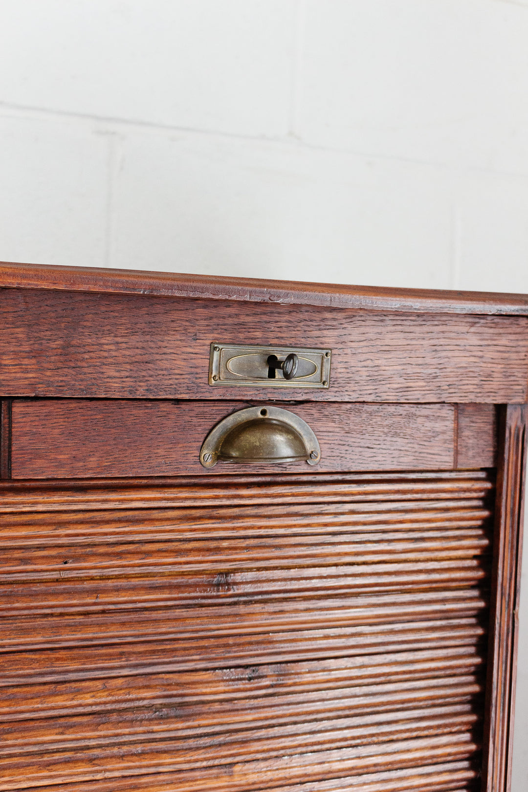 art deco oak tambour fronted filing cabinet with key