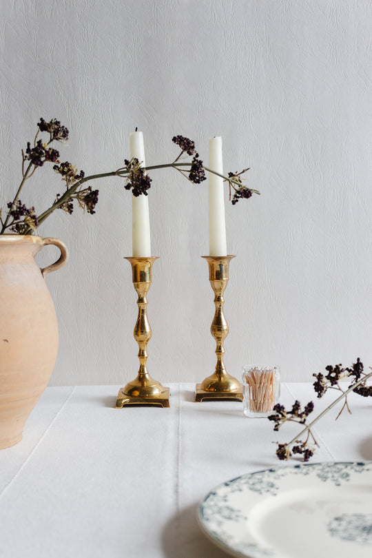 pair of vintage quintessentially french brass candlesticks