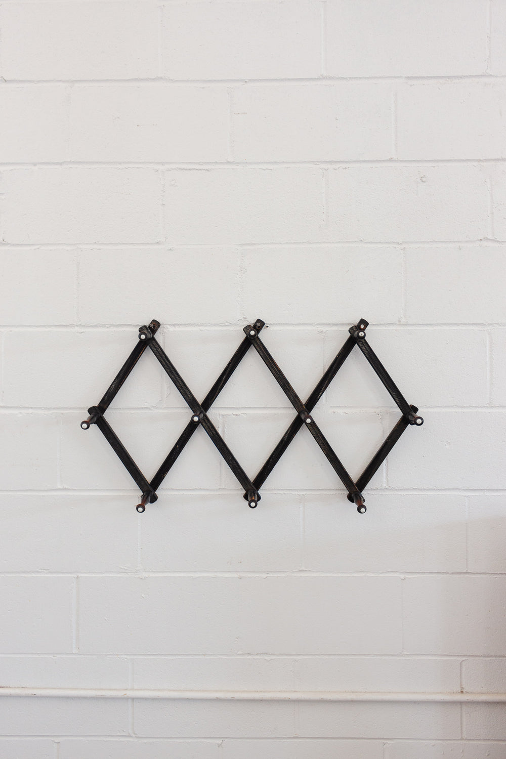 antique victorian accordian ebonized wood coat rack