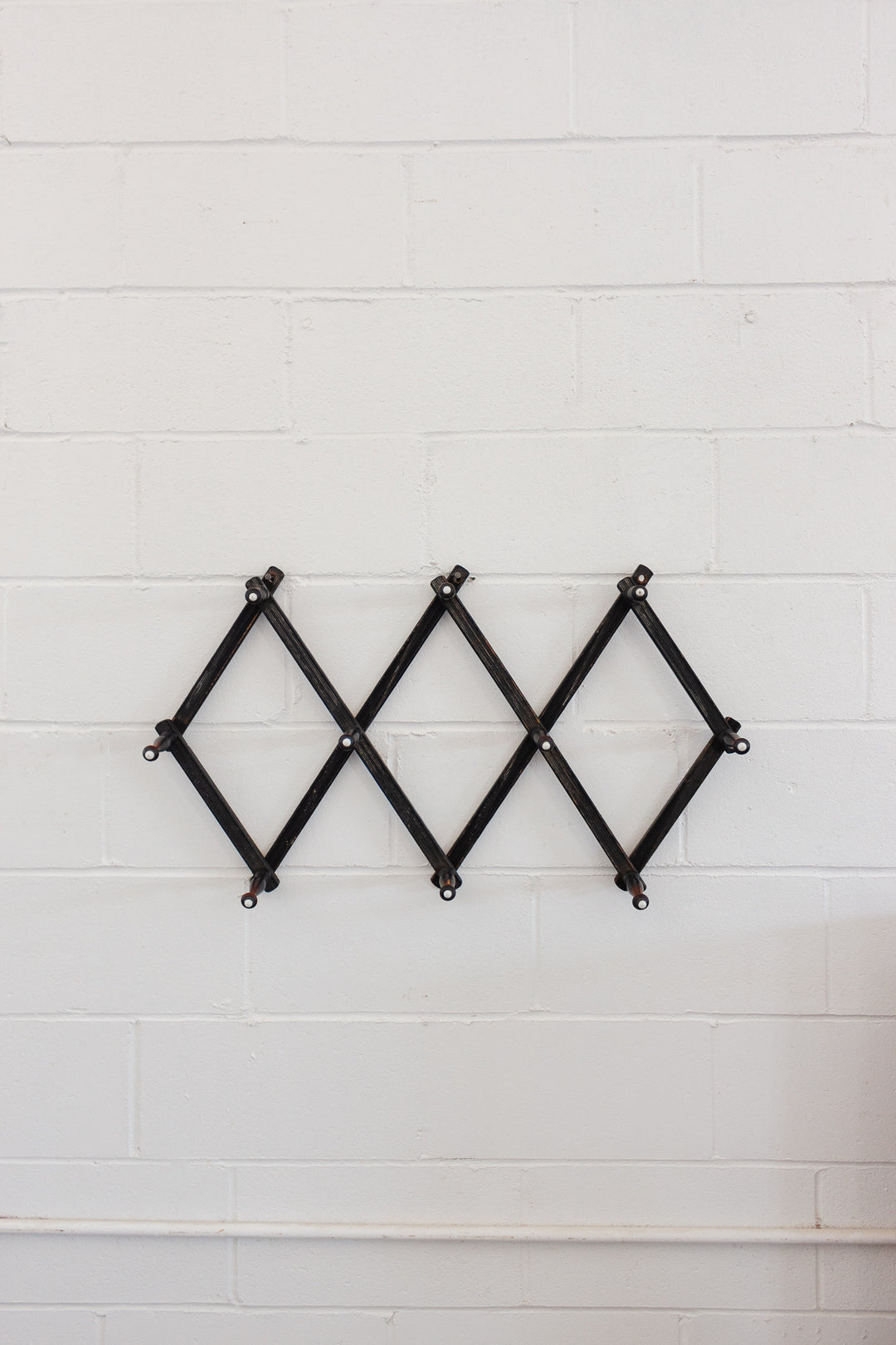 antique victorian accordian ebonized wood coat rack