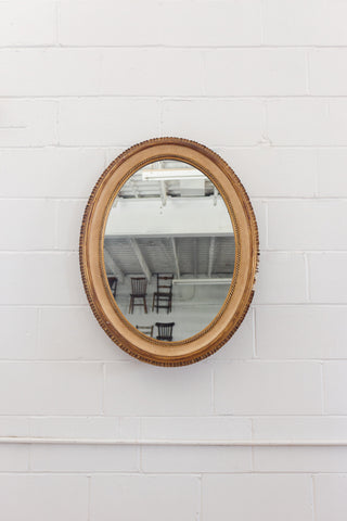 vintage French gilt wood and plaster oval mirror