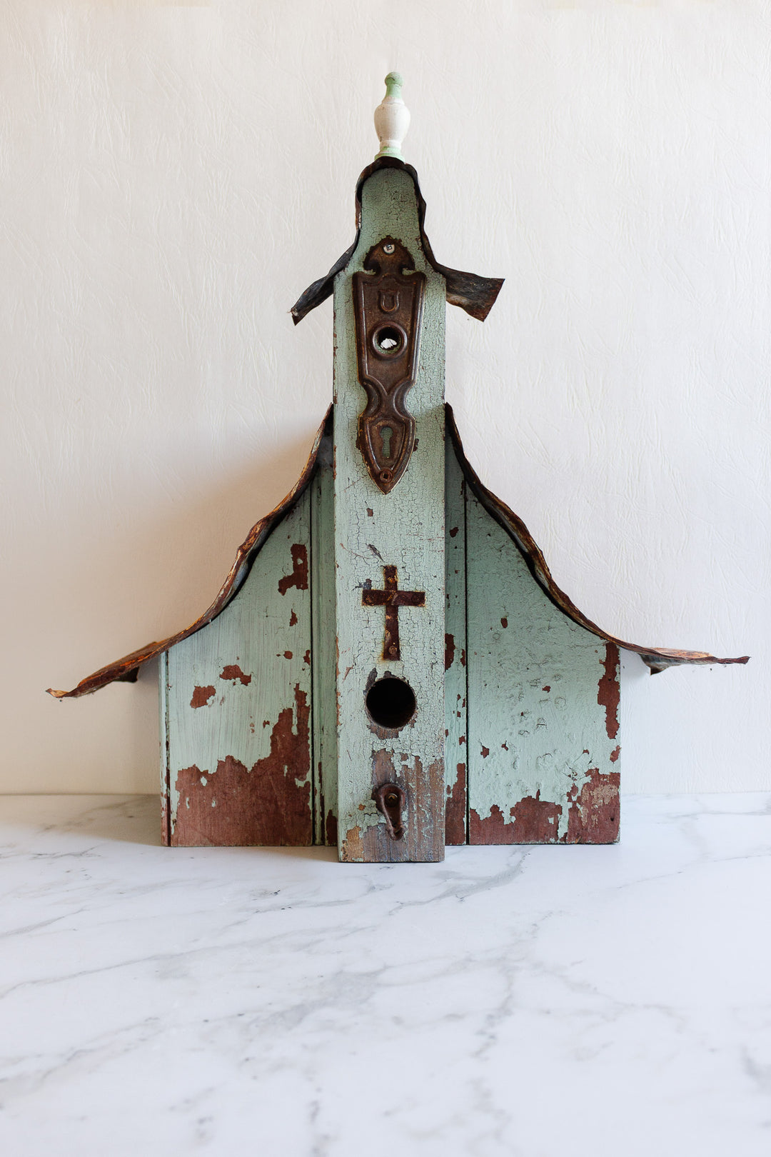 antique European wooden bird house with tin roof