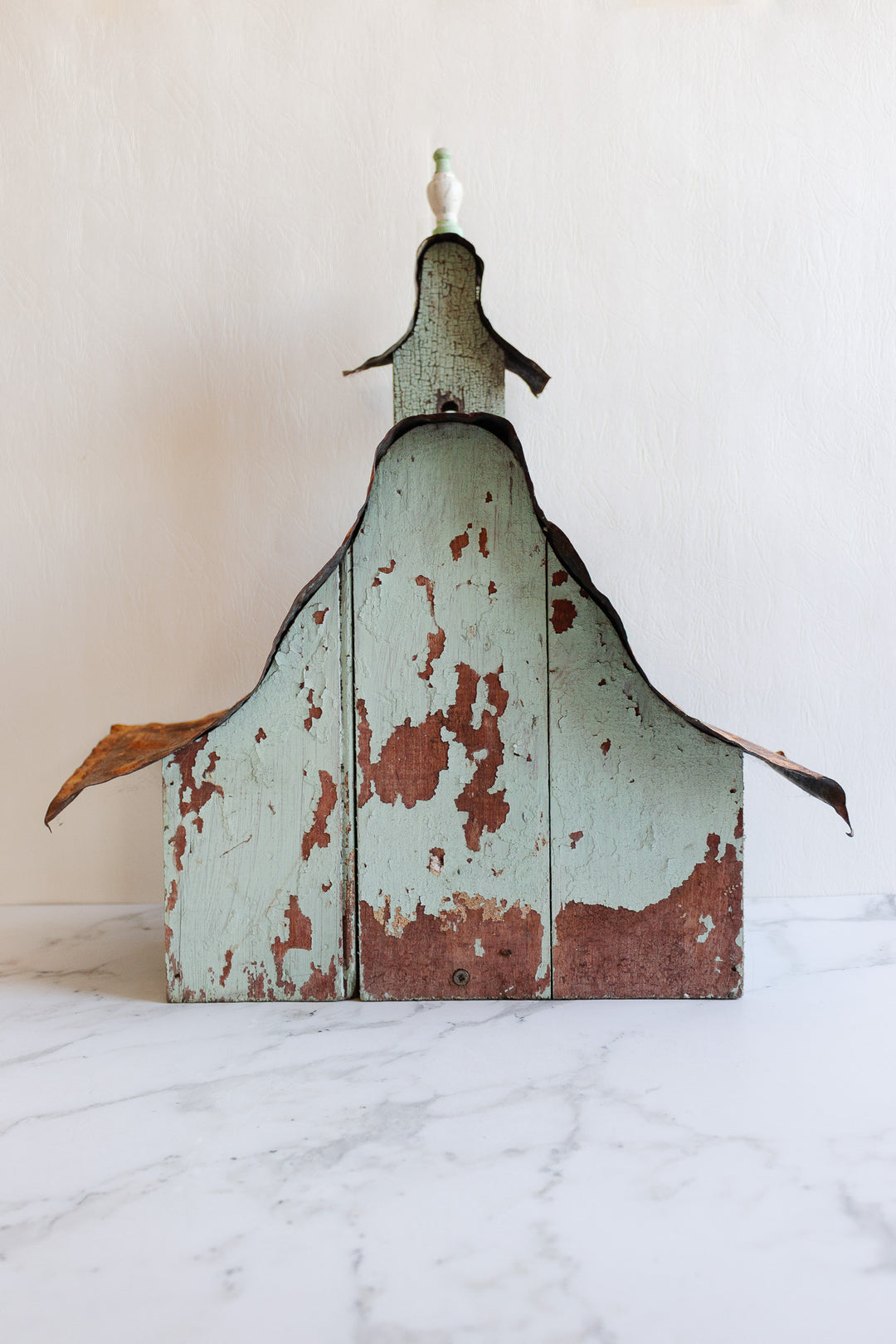 antique European wooden bird house with tin roof