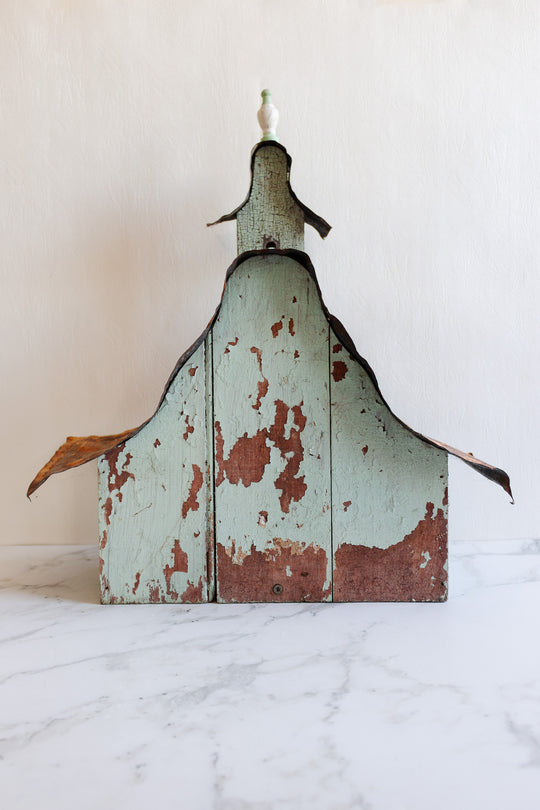 antique European wooden bird house with tin roof