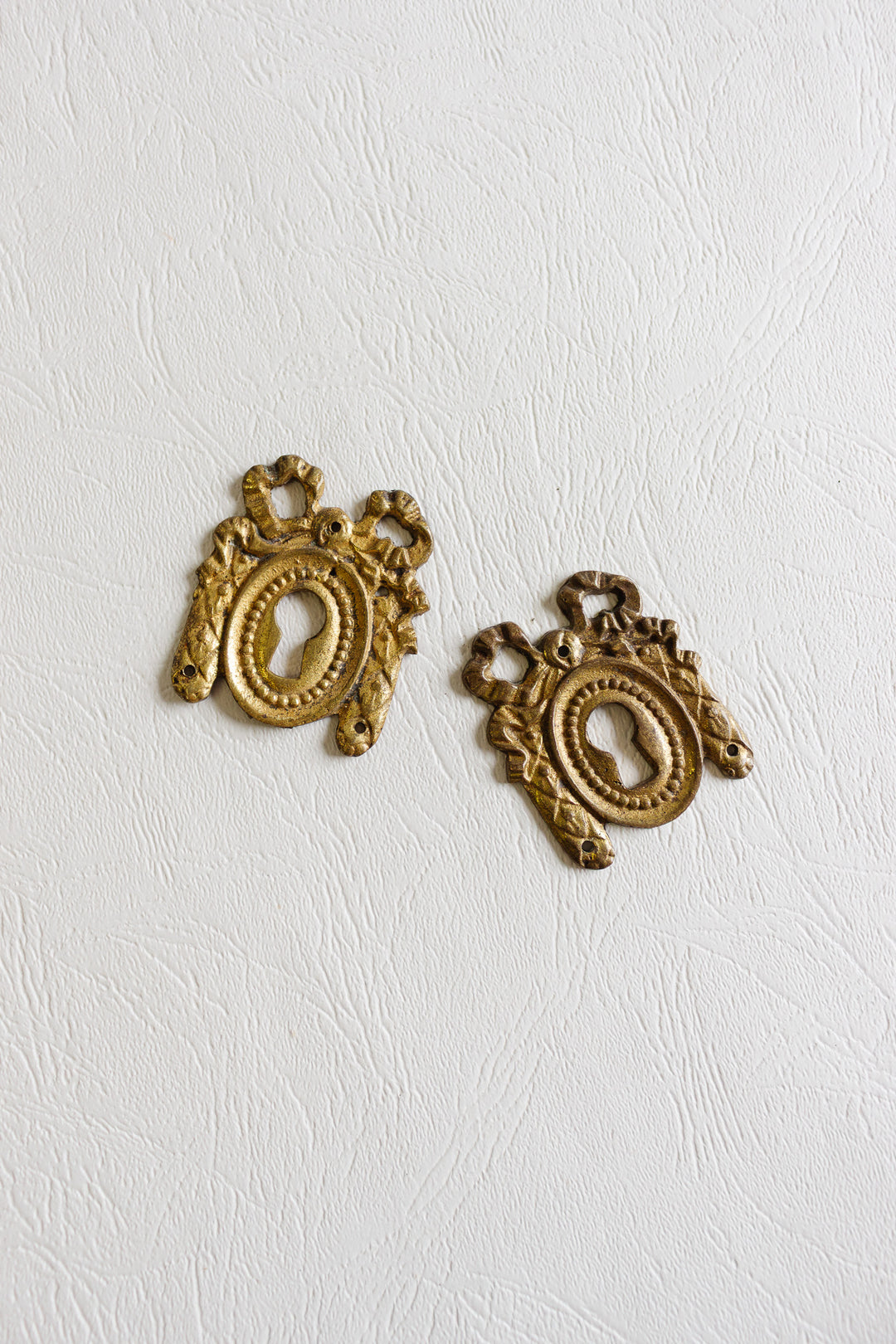 pair of antique french keyhole escutcheons