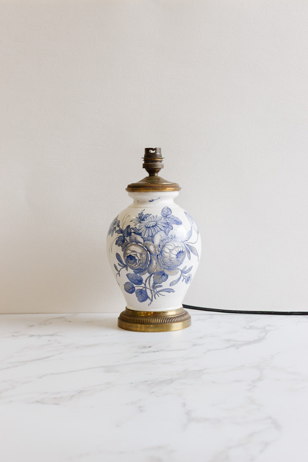 antique french porcelain lamp with brass footing