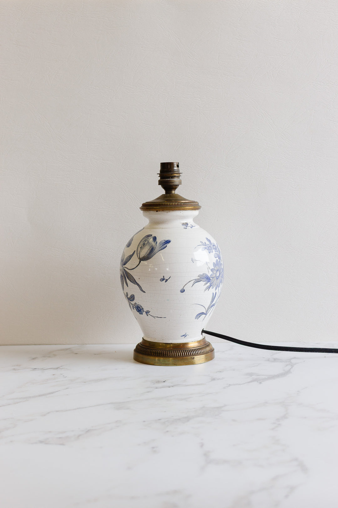 antique french porcelain lamp with brass footing