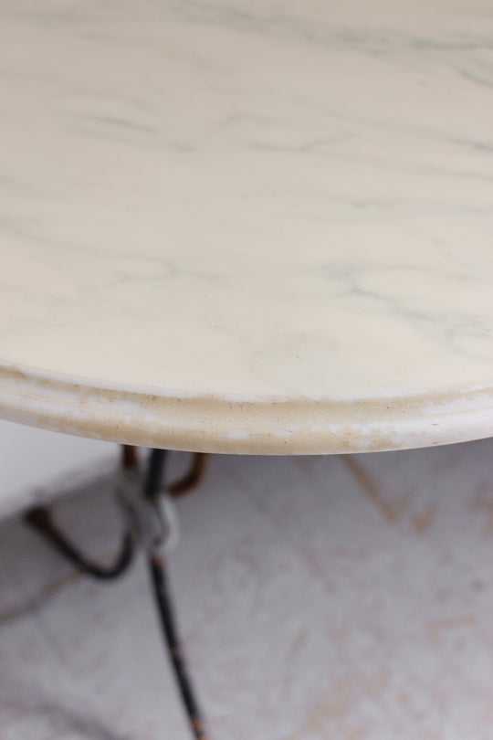 French bistro table with antique cast iron base and vintage marble top