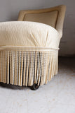 antique french slipper chair with fringe