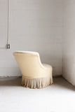antique french slipper chair with fringe