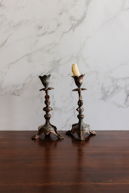 antique cast metal figural candlestick pair