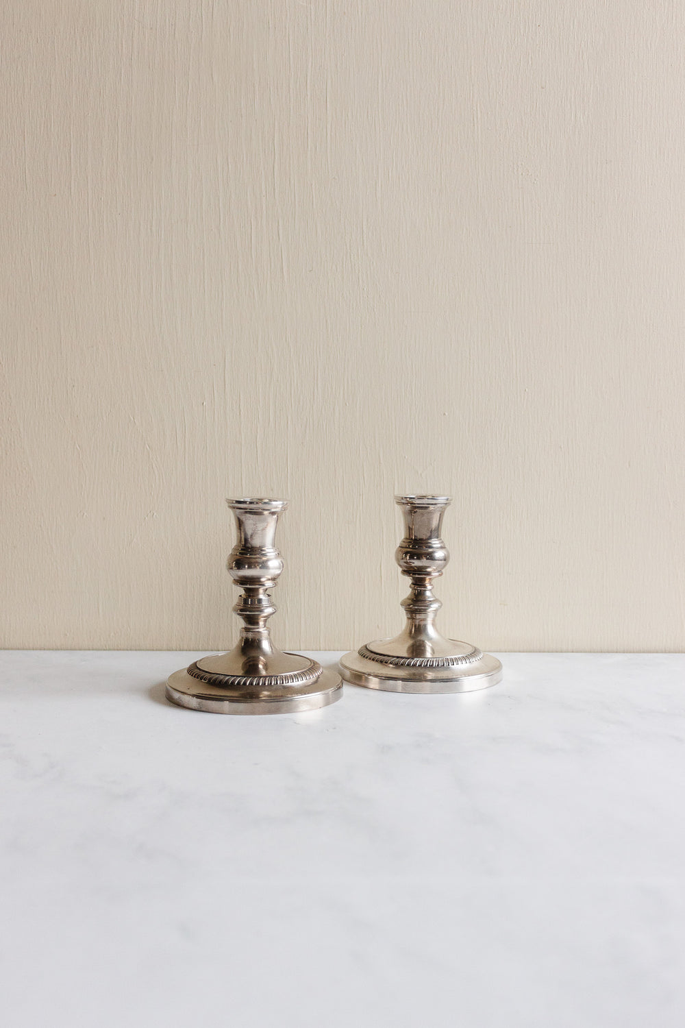 pair of 1930s french stamped silverplate candlesticks