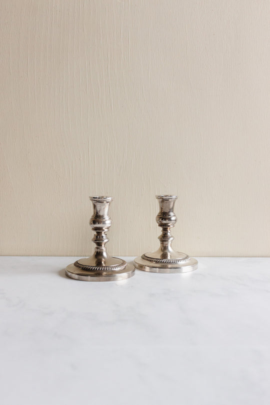 pair of 1930s french stamped silverplate candlesticks